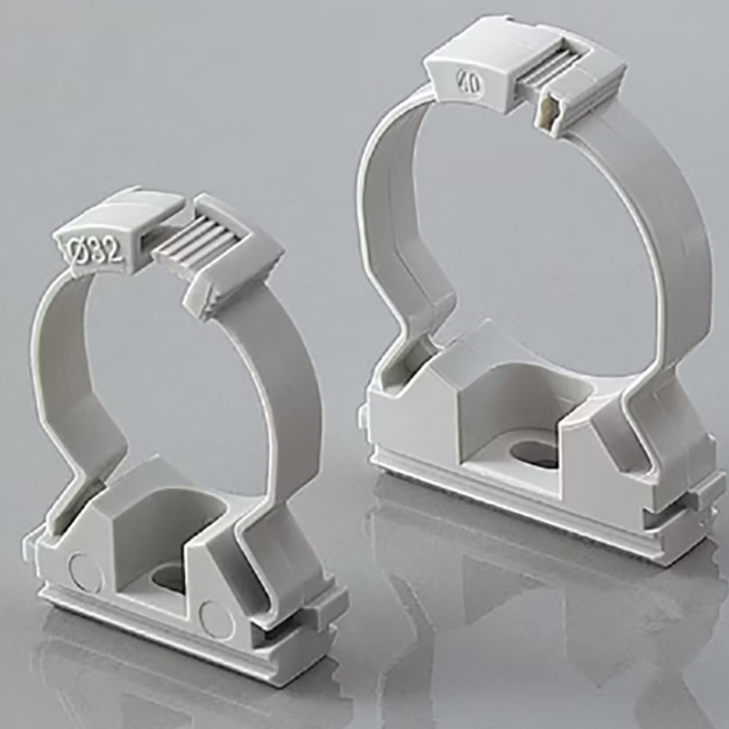 Plastic pipe straps molding